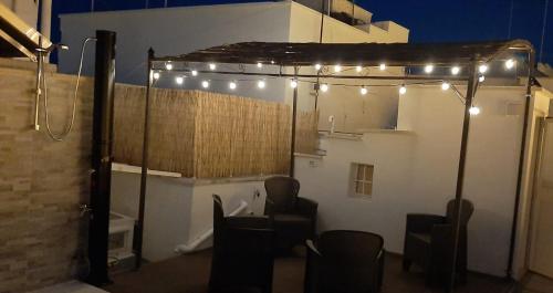 a room with lights on the side of a building at La Finestra su Santa Lucia in Monopoli