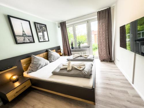 Cama o camas de una habitación en Apartment für 3 Gäste mit kostenlosen Parkplätzen und Lift