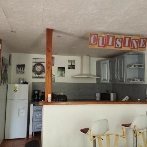 a kitchen with a counter and a refrigerator at Cosy en Provence in Maillane