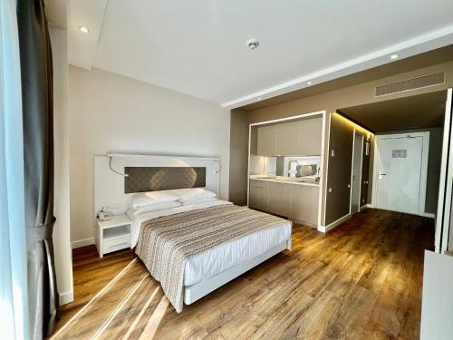 מיטה או מיטות בחדר ב-My Sunshine Apartments in Aliance Palace