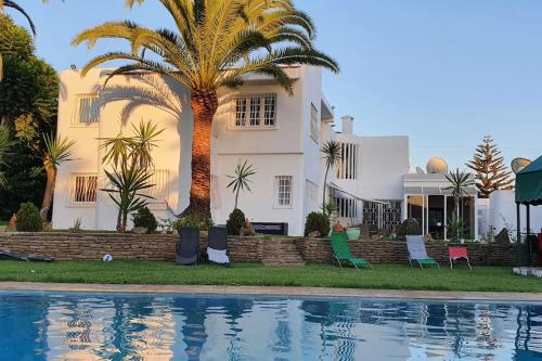 Der Swimmingpool an oder in der Nähe von Villa SAMO Rabat prived pool