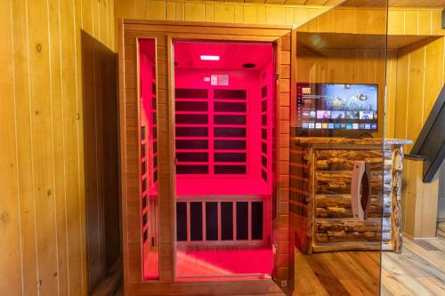 a room with a red door with a window at Gatlinburg Cabin With Breathtaking Views, Hot Tub, Sauna, 10 min to downtown and National Park in Gatlinburg