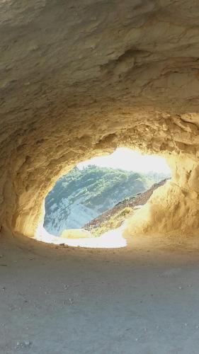 a cave with a view of the ocean through it at Mar-Beach front apartment in Jávea in Jávea