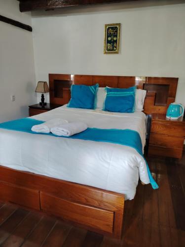 Кровать или кровати в номере La Posada