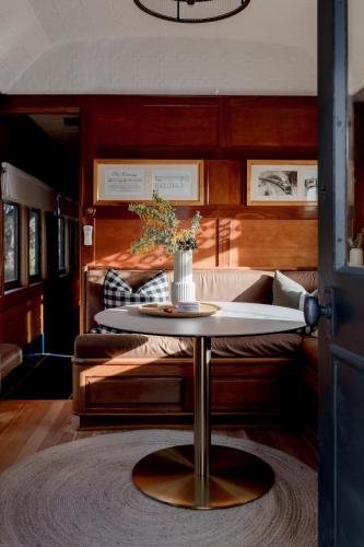 a table with a vase on it in a room at The Station Hunter Valley in Pokolbin
