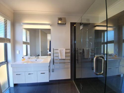 a bathroom with a sink and a shower at Southholm in Lake Tekapo