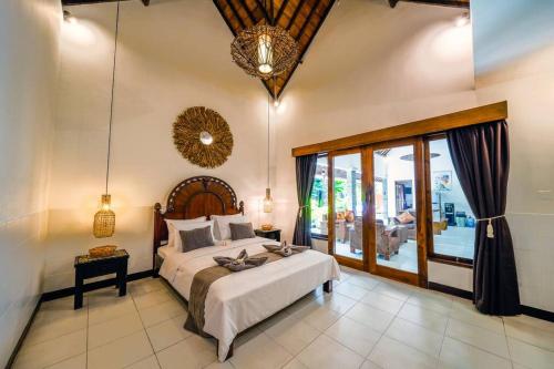 Giường trong phòng chung tại Villa JES - 4 Bedroom Villa - Legian
