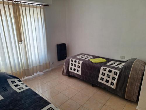 Postel nebo postele na pokoji v ubytování Sweet Home departamento
