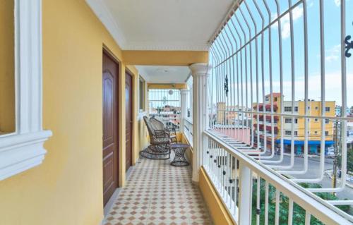 a balcony with a view of a building at BNB Family Vacation Rentals, Corales del Sur, Santo Domingo Este in La Viva