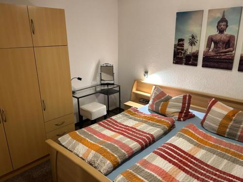 Ένα ή περισσότερα κρεβάτια σε δωμάτιο στο Ferienbungalow Meerjungfrau im Seebad Ueckermünde