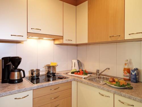 Kuchyň nebo kuchyňský kout v ubytování Appartement Hotel Erlhof Deluxe