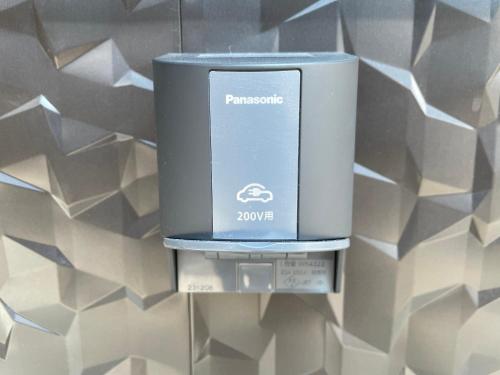 a soap dispenser is hanging on a wall at 一棟貸しnuevoL7～暮らすように泊まる北群馬の冒険はここから in Numata