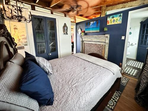 a bedroom with a bed in a rv at Salty Dog Cottage in Surfside Beach