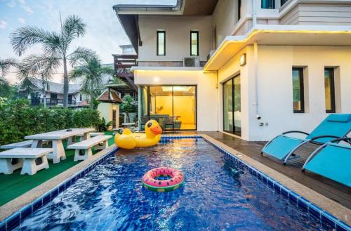 a pool with a rubber duck in the middle of a house at Luxury 250sqm Pool Villa in Central Location 5min to Beach & Walking Street! in Pattaya Central