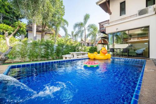 a pool with a rubber duck toy in a swimming pool at Luxury 250sqm Pool Villa in Central Location 5min to Beach & Walking Street! in Pattaya Central