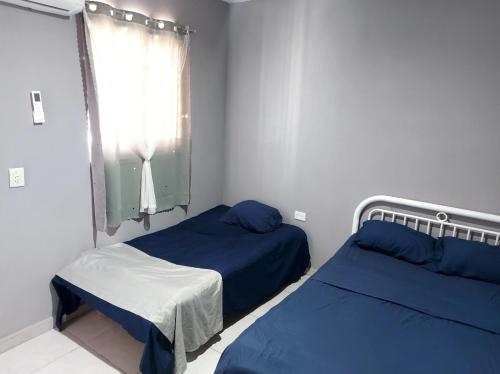 Ένα ή περισσότερα κρεβάτια σε δωμάτιο στο Residencia El Encanto