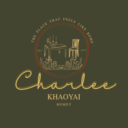 a logo for a restaurant with a table and a chair at Charlee Khaoyai in Mu Si