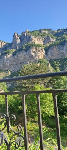 a view of the mountains from a balcony at Къща за гости Марчела и Ресторант Мъри 