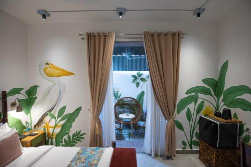 a bedroom with a bird painted on the wall at The Sierra - By The Lake in Udaipur