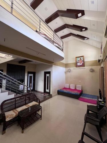 a room with several pillows on the floor of a building at Kusum Villa in Varanasi