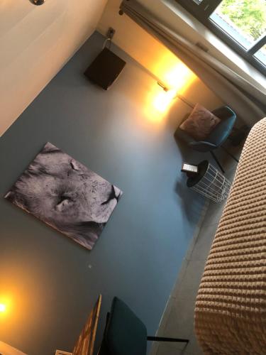 an overhead view of a living room with a couch and chair at Selemo B&B - Business and leisure - guestroom with private entrance - ensuite bathroom - free parking in Ghent