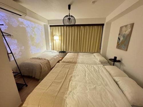 Ένα ή περισσότερα κρεβάτια σε δωμάτιο στο waseda house