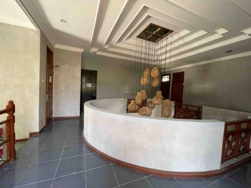 a large room with a large tub in a building at Venus- 1br pvt pool villa in kuta By iLys Collection in Kuta
