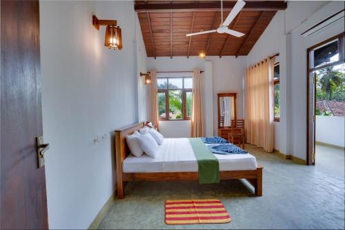 Ένα ή περισσότερα κρεβάτια σε δωμάτιο στο Mandari Villa