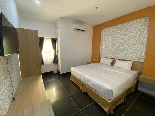 En eller flere senger på et rom på MIỀN TÂY HOTEL CANTHO