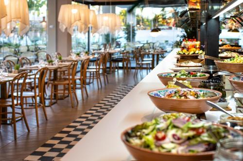 a buffet line with bowls of food on display at Maspalomas Princess in Maspalomas