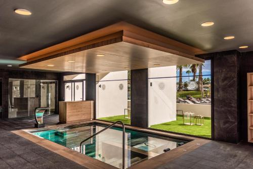 a house with a swimming pool in the middle at Maspalomas Princess in Maspalomas
