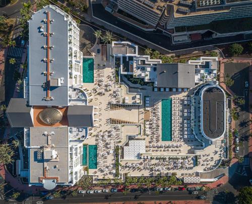 an aerial view of a building with a beach at Princess Inspire Tenerife - Adults Only in Adeje