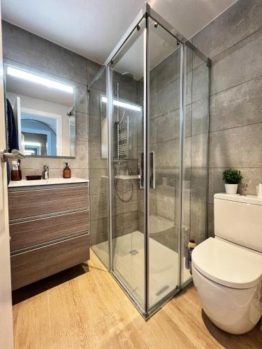 a bathroom with a shower and a toilet and a sink at BONAVISTA PLATJA BEGUR in Begur