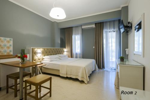 Ένα ή περισσότερα κρεβάτια σε δωμάτιο στο Hotel Oriana - Adults Only