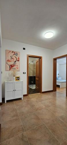 an empty room with a large room with a large room with at Apartment Bluemare B6 with Shared Pool in Ližnjan