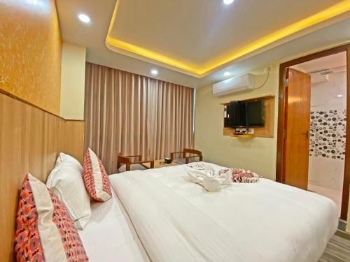 Кровать или кровати в номере Hotel Lumbini Airport