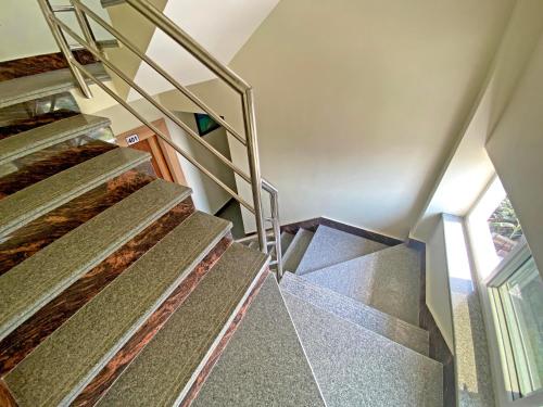 a set of stairs in a house at Hotel Lumbini Airport in Kathmandu