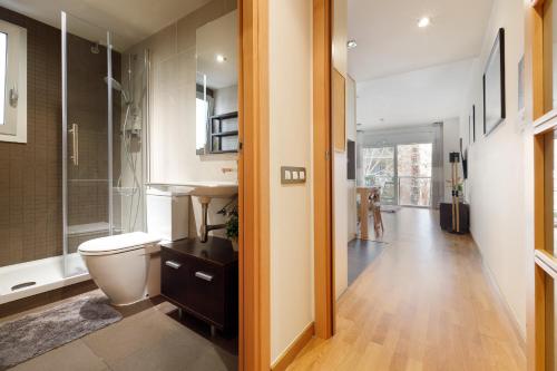 a bathroom with a toilet and a sink at Beach-line family apartment Barcelona in Barcelona