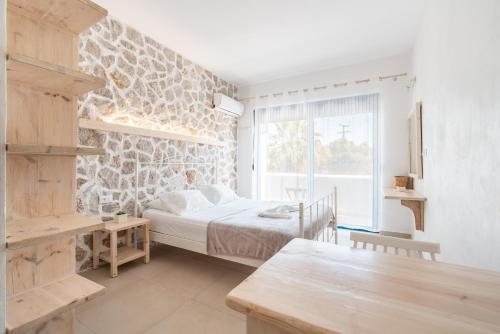 Ένα ή περισσότερα κρεβάτια σε δωμάτιο στο Studios Maria Christina