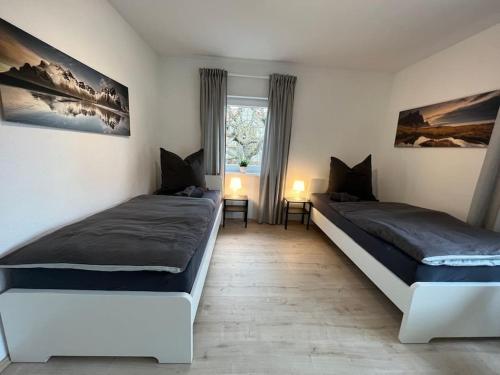 Postel nebo postele na pokoji v ubytování NÜ03-BP Haus für Firmen
