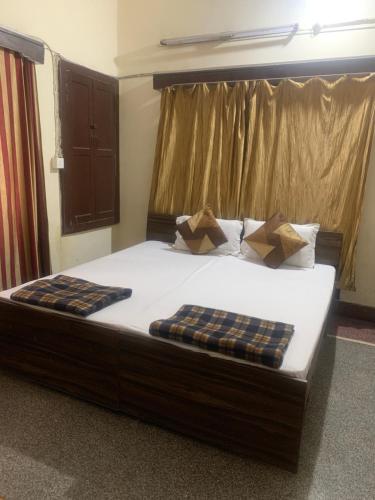 Säng eller sängar i ett rum på Kanchan Home stay Dehradun