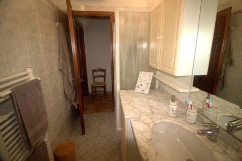 a bathroom with a sink and a counter top at CASA TARTARUGA in La Spezia