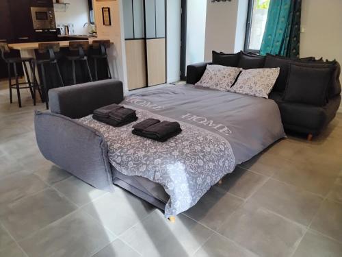 Katil atau katil-katil dalam bilik di Gîte Chez Marie T 8 personnes