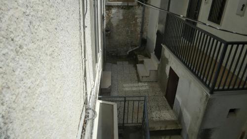 an overhead view of an alley with stairs in a building at La stalla della principessa The Princess stable by Pianta land in Orsara di Puglia