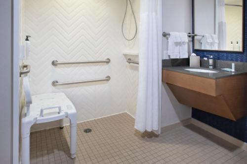 a bathroom with a sink and a toilet at Fairfield by Marriott Rochester Henrietta/University Area in Henrietta