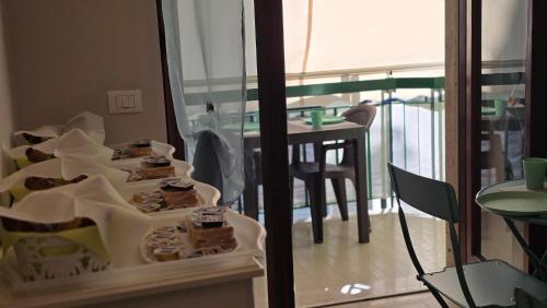 a room with a table with food in boxes at AD UN PASSO DAL MARE in Praia a Mare
