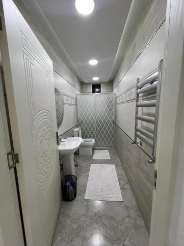 a small bathroom with a sink and a toilet at My_willa_Buzovna in Zağulba Bağları