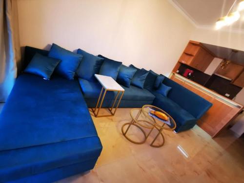 a blue couch in a living room with a table at The View hotel in Hurghada