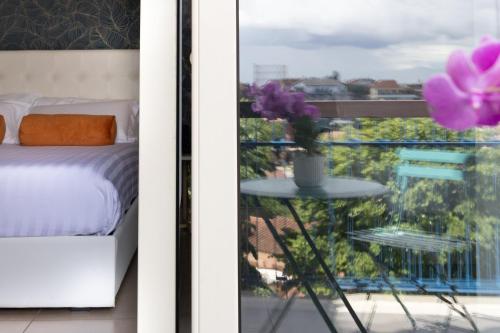 Postel nebo postele na pokoji v ubytování Zaccardi Roof Garden