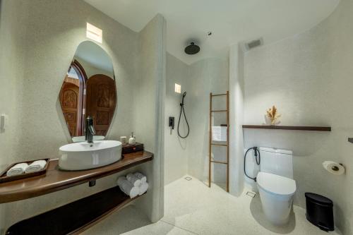 a bathroom with a sink and a toilet at Saha Casa Boutique Hotel Da Nang in Da Nang